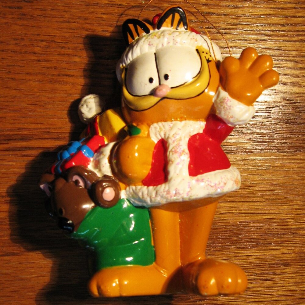Garfield dressed as Santa with gift sack over right shoulder Christmas Ornament